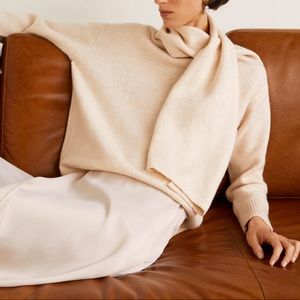 Knit sweater with attached scarf